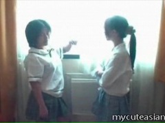 Asian Nudes presents: Amateur asian schoolgirls kiss tits in hotel room
